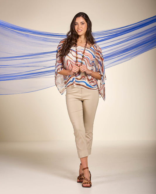 Poncho in georgette fantasia onde con spallina gioiello e paillettes sul fondo