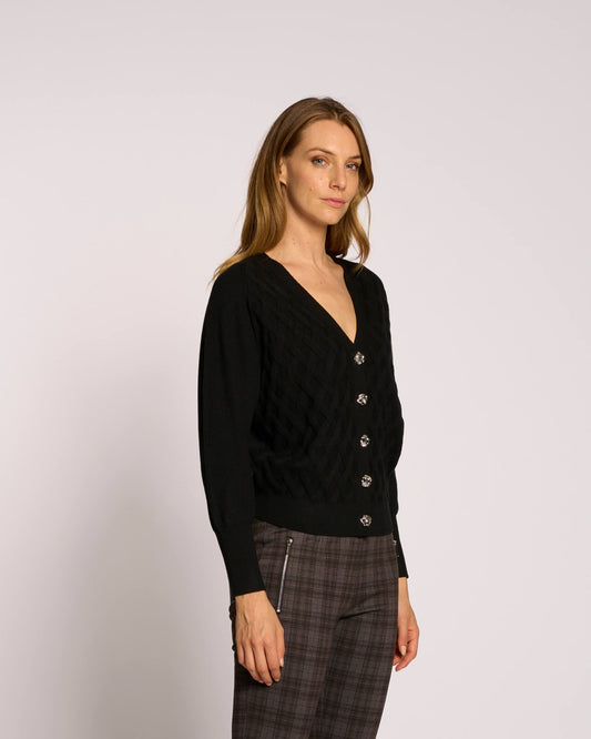 Maglia con intrecci e spalla scesa