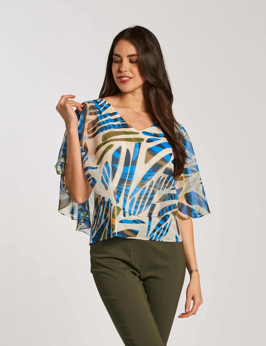 Poncho fantasia con fondo di paillettes