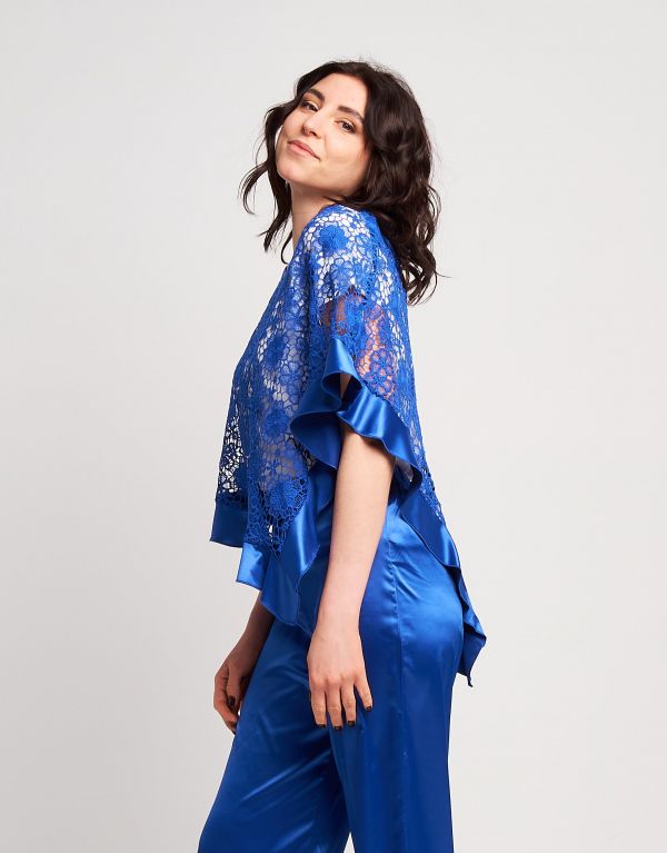 Poncho in pizzo con volants...