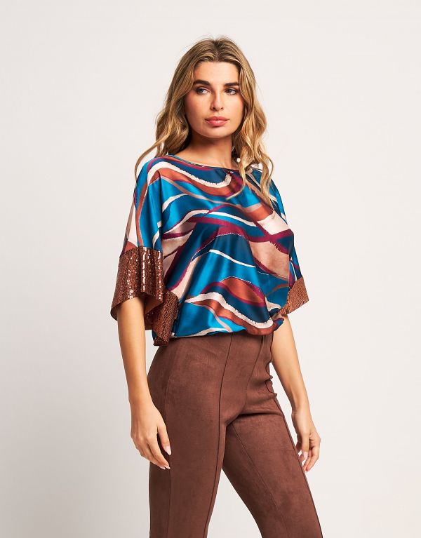 Poncho in raso con elastico...