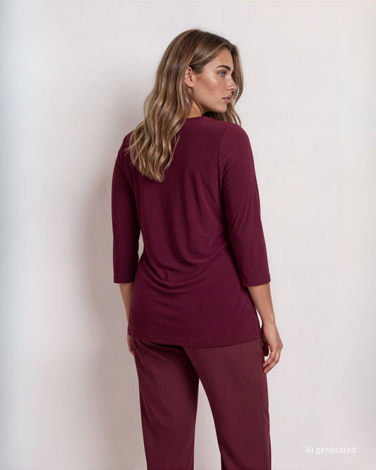 Maglia in jersey con nodo laterale che crea drappeggio