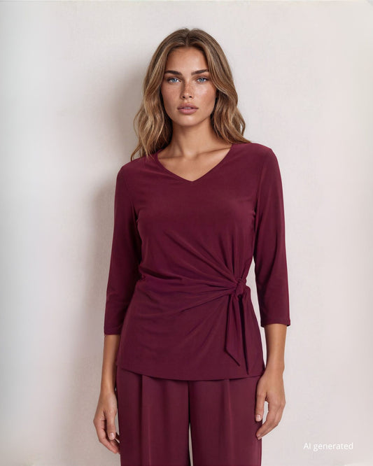 Maglia in jersey con nodo laterale che crea drappeggio