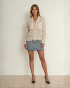 Giacca in pizzo revers con tasche e bottoni sul fronte panna