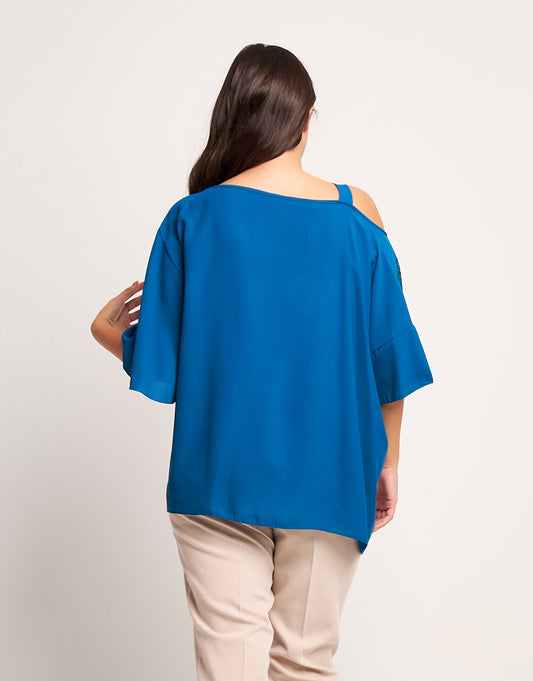 Poncho asimmetrico pavone con paillettes curvy