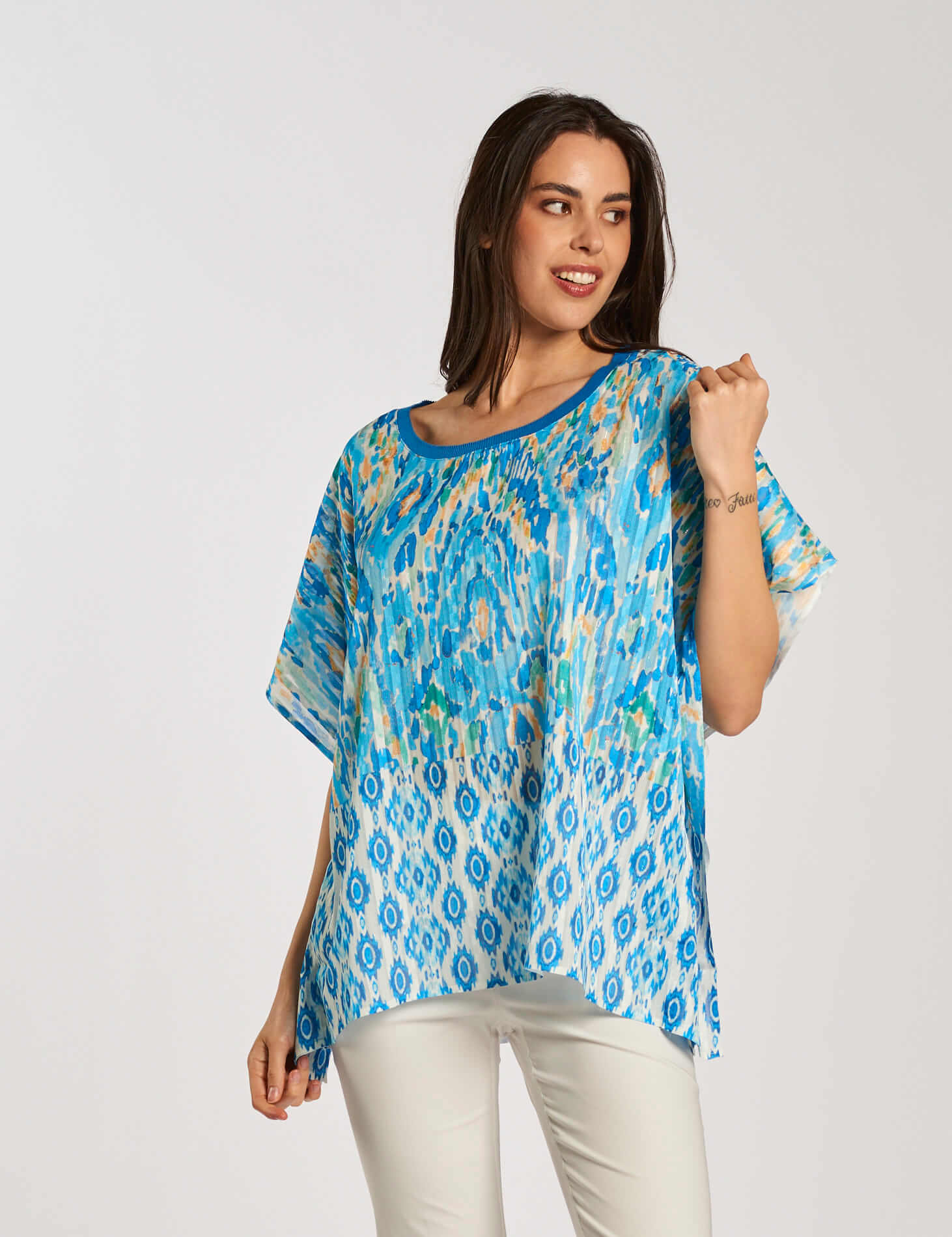 Poncho in georgette fantasia turchese