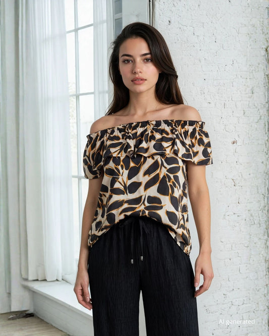 Top in viscosa fantasia foglie con elastico sulle spalle e volant