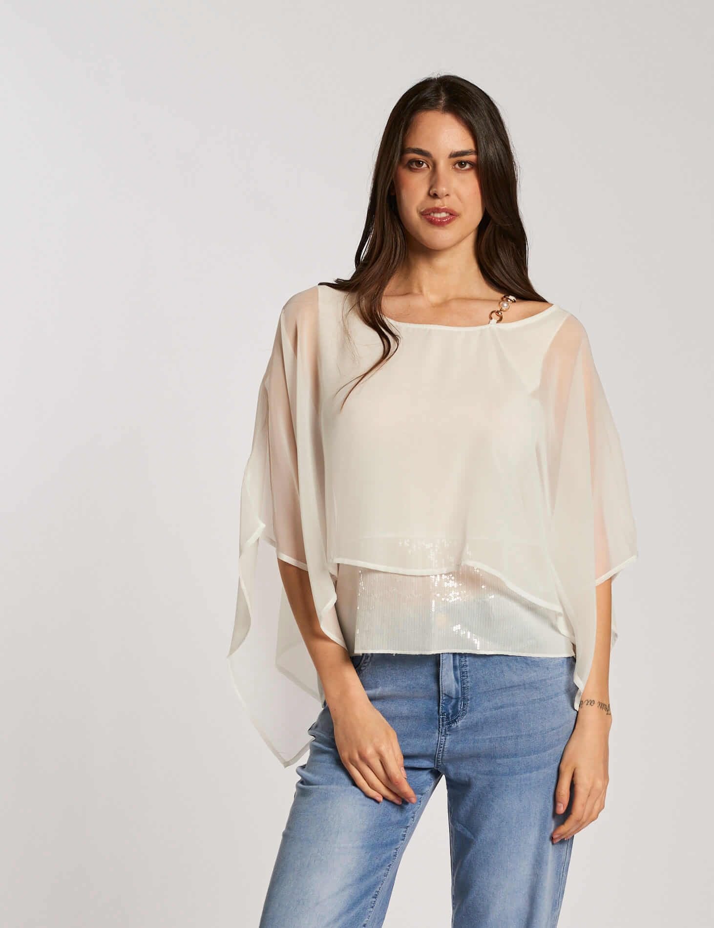 Poncho con accessorio e paillettes
