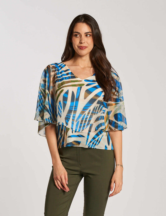 Poncho fantasia con fondo di paillettes